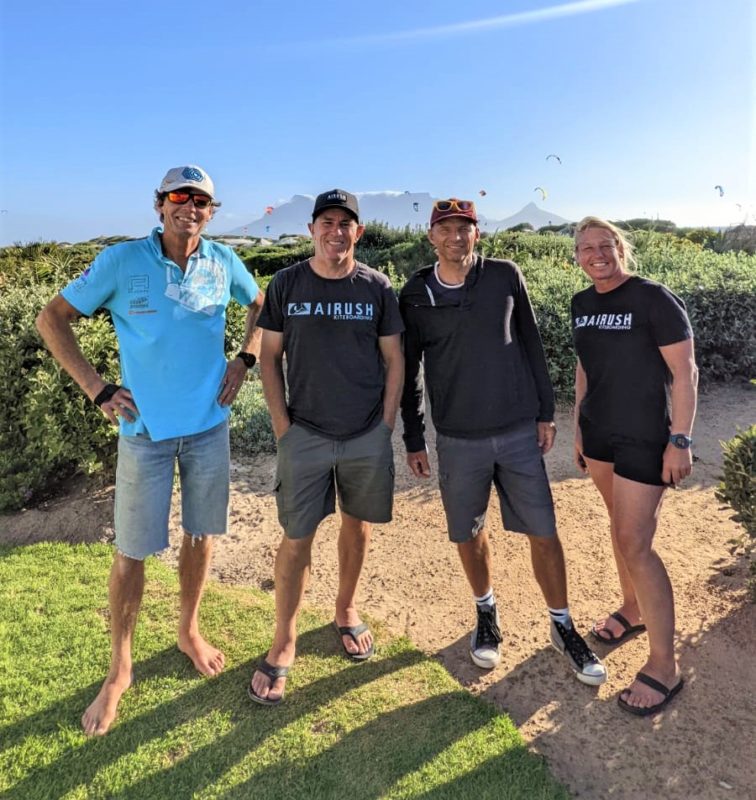 Picture of Olaf van Tol, Dave Kay, Cedric Vandenschrik, Su Kay at dolphin beach cape Town with table mountain in the background