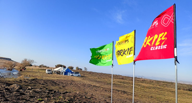 red yellow and green flags in front of event site at Sterfontein Dam