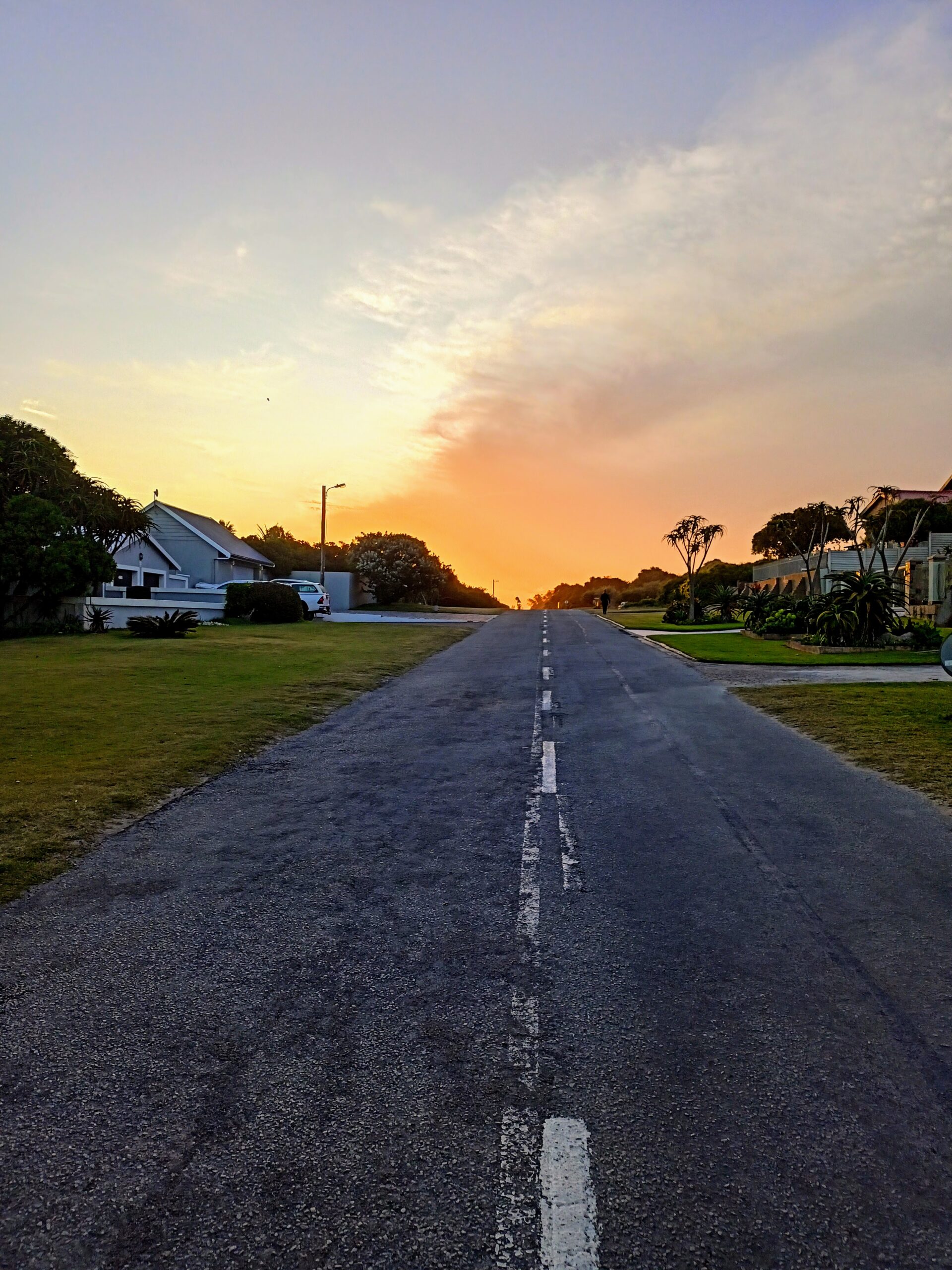 Road leading into sunset